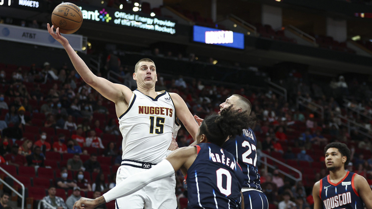 Denver Nuggets center Nikola Jokic (15) attempts to control the ball during the fourth quarter against the Houston Rockets.